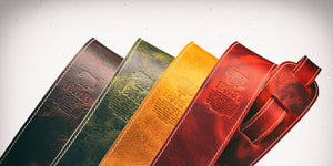 Boutique Series leather guitar straps by Bison Boa | The Grand Patina guitar strap shown in Tobacco Burst, Olive Burst, Honey Burst and Lava Burst | These boutique guitar straps are made with ultra premium Italian leather by Badalassi Carlo.